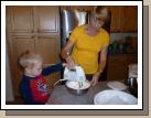 Two year old Daniel Crapo has a complete and total fetish for anything with a cord that plugs in.  He came running when he heard the beaters start up and Melinda decided to let him help whip the cream for the fruit salad.
