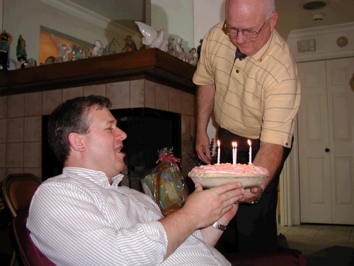 Singing Happy Birthday to Alan with a "mile high strawberry pie!"  This is a dessert from childhood brought back especially for his birthday.