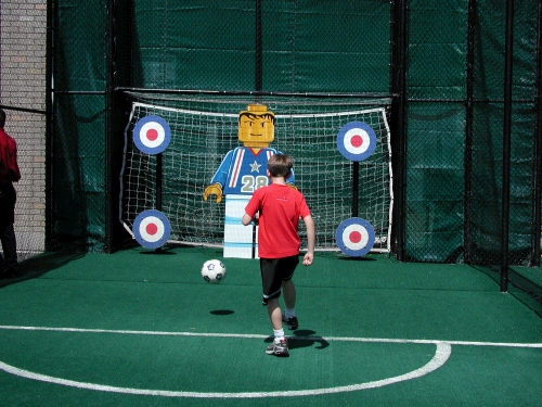 Elliot playing soccer with the Lego soccer guy.  You should have heard the cheering!