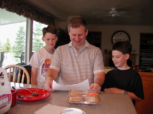 Elliot and Clark gave their Dad peanut butter cookies and a certificate to go bowling with them that expired the next day -- so they had to go that very morning!