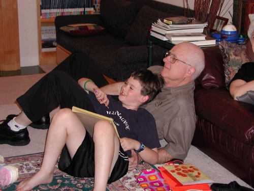 We didn't know it at the time, but Clark was charting a graph while Madeleine was opening presents.  He wrote down each gift and how many times she screamed when she opened each one.  What a goofy kid!