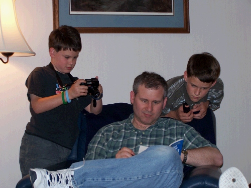 Already starting a Sudoku puzzle -- a budding photographer and a budding Sudoku puzzler watching over his shoulder.