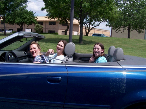 The girls get a ride in Bonnie's new blue convertible.