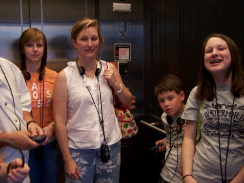 Kaitlin, Bonnie, Clark and Madeleine taking the elevator up to the museum.