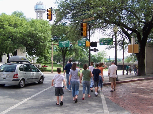 This is our group walking down to see the spot on the street where Kennedy's car was when he was assisnated.