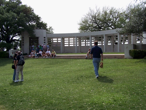 Alan walking up the famous "grassy knoll," which was on one side of the street.