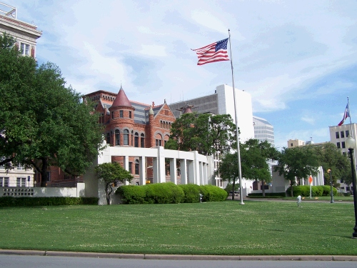 This is the area across the street from the "grassy knoll," called Dealy Plaza where many people were standing and waving to the President and his wife at the time he was shot.