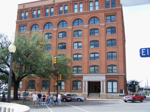 Here is a better shot of the building.  The famous window is on the far right -- second from the top.  The group crossing the street is our group.