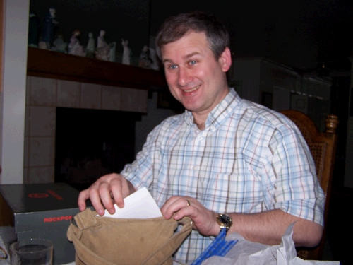 Tess "wrapped" her gift in her purse, so Alan had to dig through the purse to find it.