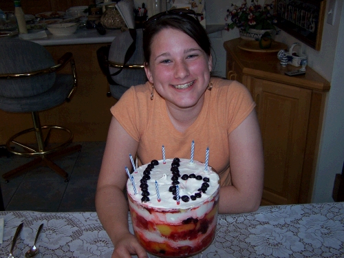 A yummy trifle with the number 16 out of blueberries...