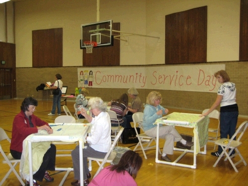 Tying baby quilts for Ronald McDonald House