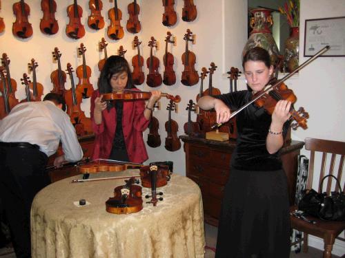 She got to try out several violins.