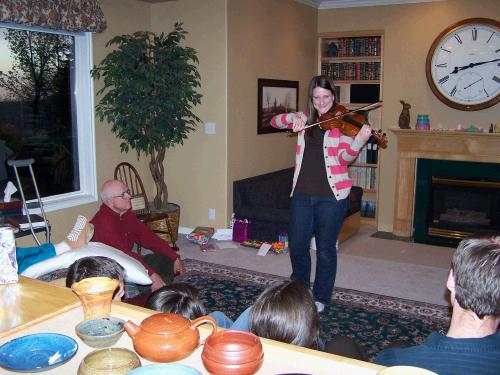 Madeleine demonstrating her new violin.