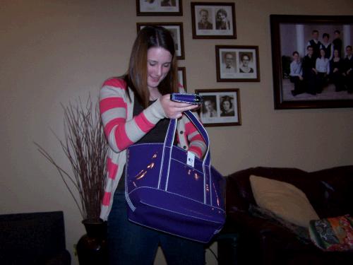 After running all over the house, she found the great bag and wallet from Land's End that she had been admiring.