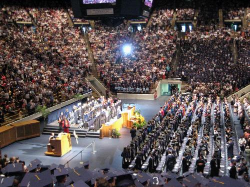 BYU graduation. Loren's fiance Anne Bogue is on the fourth row from the back down on the floor about 8 people in or so.  We were happy to finally find her!  If you look at the bottom of the photo you can see that a graduate has the number 3 on her hat -- that is my cousin Becky Breinholt.  She is sitting next to her sister Liz and their mother, my Aunt Susan who have the numbers 1 and 2 on their hats.  Three graduates in one family -- way to go!