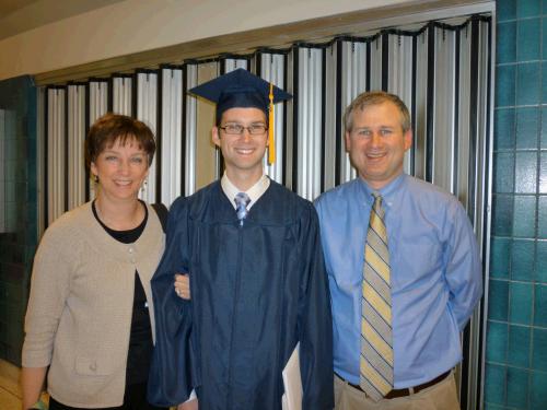 Loren with his proud parents.  One college graduate...5 to go....