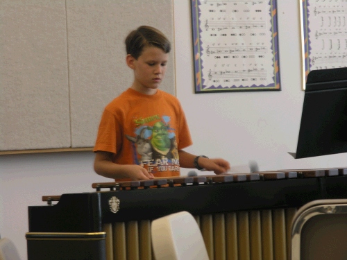 Elliot taking his marimba lesson -- he is really sounding good...