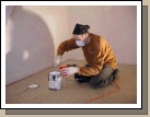 Jared thinning the paint in preparation for spraying the closet.