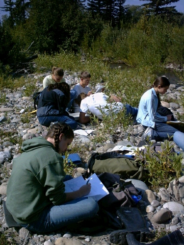 Madeleine writing in her science journal during her Interim trip in the Tetons.