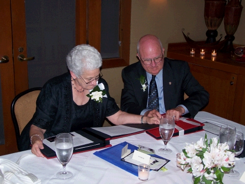 Pat and Wally looking at the memory books -- they loved them.  Diane did a wonderful job.