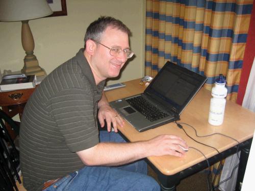 Alan working away all day in our bedroom while we played -- the life of the bread winner....