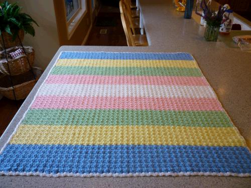 Ta Da!  I finished my summer project -- a crib blanket to cover my future darling grandbabies while they nap at my house.  This is not an announcement of any kind...