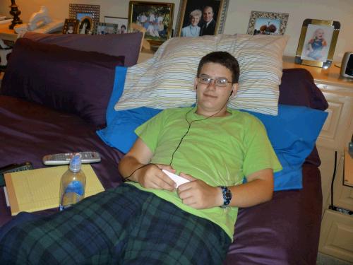 Clark recuperating from his tonsillectomy.  He did great!  Good thing he's always had a passion for yogurt, pudding and ice cream!