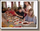 The cousins having fun decorating their gingerbread men.