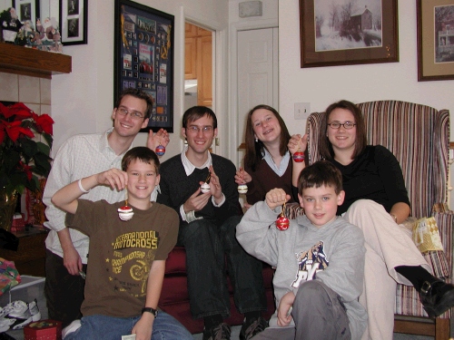 All the kids with their ornament from Grandma and Grandpa -- an ornament with a bit of "green stuff" from their Great Grandma Louise's estate.