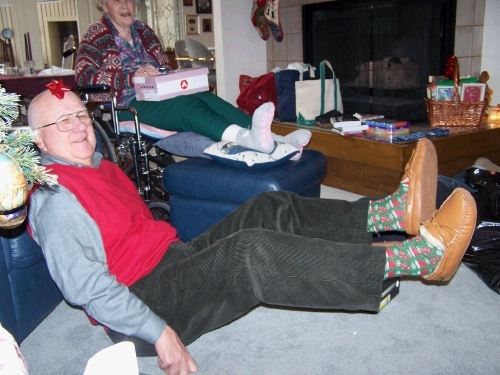 Grandpa displaying possible replacements to his 45-year-old favorite slippers.  