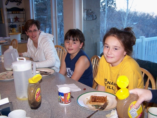 Melora, Jennica and Miranda trying out the new waffle and syrup recipe.