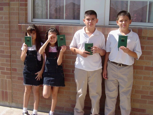 Castillo kids with their new hymn books and CTR rings.