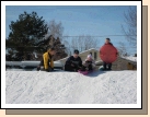 Elliot and Parker helping Karen and Andrew down the "kiddie" hill.