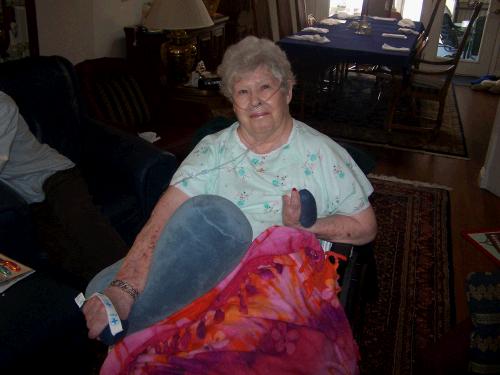 Proudly showing off her new bracelet on her new comfy pillow!