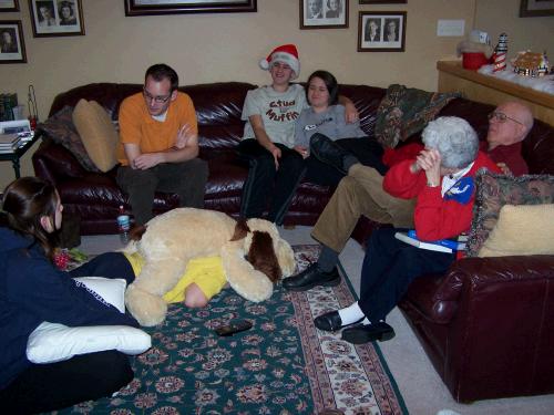 Sitting around listening to and talking with Phillip in Madrid Spain.  Note the cordless phone in the middle of the floor. Clark is somewhere under that big dog!