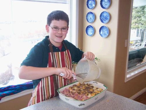 Clark prepared the traditional breakfast casserole for Christmas morning. Of course he wore his new apron from Grandma Pat!