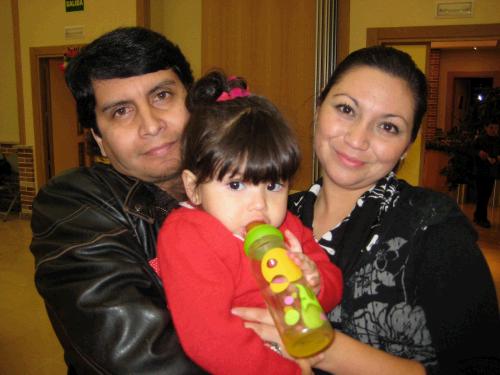 Andrea and Claudio (the father of our investigator, Gerardo) and their youngest, Isidora. They're from Chile. They have three other boys that were running around somewhere.