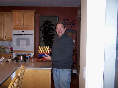 Our friend Steve Lundgren displaying the Lindt chocolate reindeer that I bought (on clearance for .25 each!) to melt down into absolutely delicious chocolate fondue.