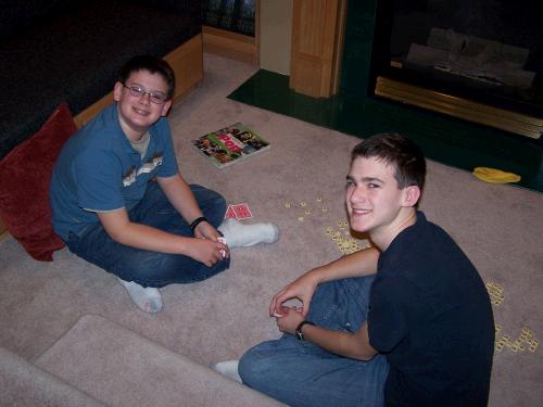 Clark and Elliot playing cards and Bananagrams.