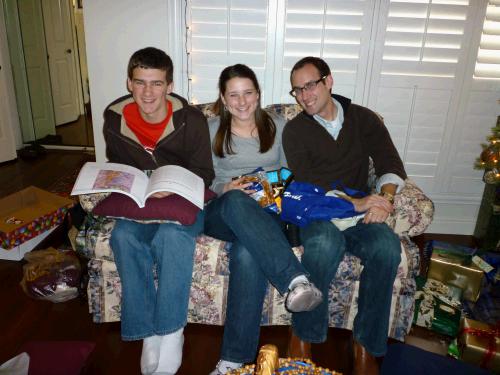 Opening some gifts from Diane -- good thing we all fit on the loveseat?!