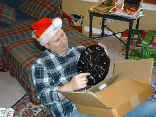 Yes it's true...I found a really cool "irrational" clock for Alan to hang in his office.  Of course he had to stop right then and there and start explaining it to us.  Were we hoping for a math lesson in the middle of opening Christmas presents?  Hmmm... I don't think so.  