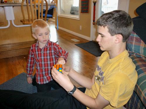 And Jackson who is giving Elliot advice on how to work his new Rubik's Cube.