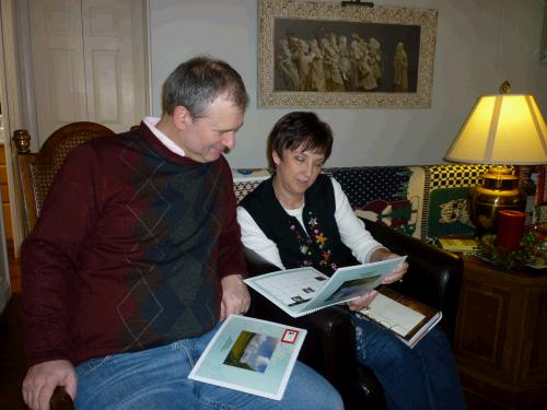 Checking out the calendars Grandpa had made for everyone.  Each month has a picture from the Berrett Family birthplace of Steeple Ashton, England.