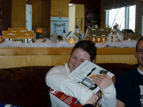 Madeleine hugging yet another kitchen accesory -- a bullet blender for making smoothies...yum.