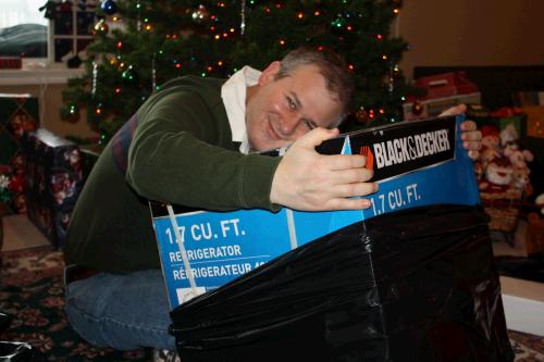 Only Madeleine could talk her Dad into hugging his new Black & Decker refrigerator.  He loves to take leftovers to work and now he can enjoy cold water!