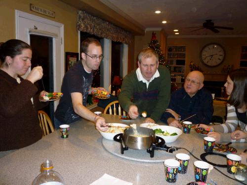 We start with a yummy Swiss cheese fondue and a beef broth for cooking small pieces of steak.