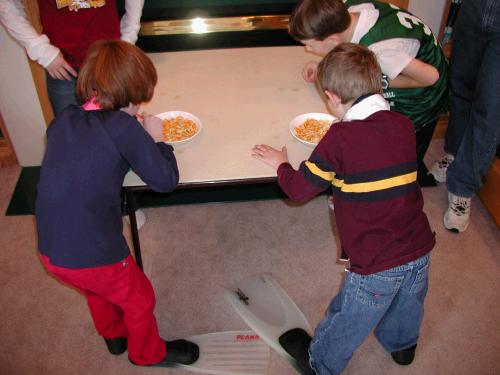 We played a relay race where the kids had to walk in flippers and pick up fishy crackers with straws.  Who thinks up these crazy games?