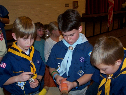 Making rockets with his friends.