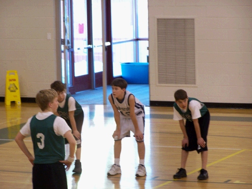 Elliot waiting to rebound a free throw.