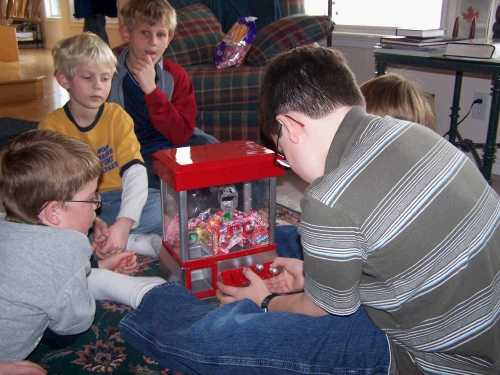 Trying to pick up a piece of candy...turns out it looks fun, but doesn't really work...too bad.